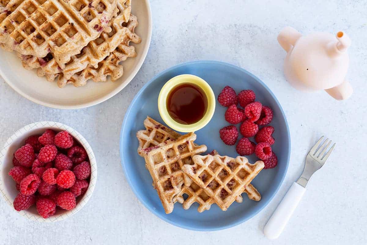 healthy-waffles-on-blue-plate-with-raspberries